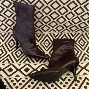 Dark brown heeled boots.